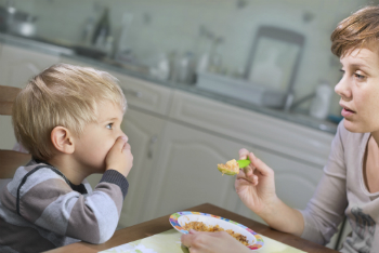 Q: Lately my toddler absolutely refuses to eat at meal times but I’m hesitant to give him more to eat at other times of the day. What can I do to ensure that he eats with the rest of the family?