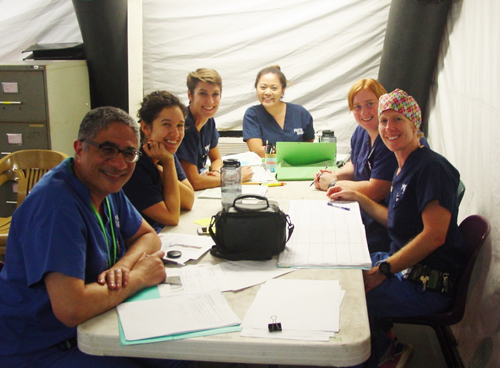 Dr. Emil, Dr. Yasmine Yousef, and Africa Mercy nurses preparing OR schedule Dr. Emil, Dr. Yasmine Yousef, and Africa Mercy nurses preparing OR schedule